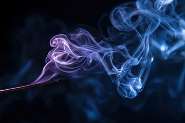 Obraz premium Abstract blue and purple smoke trails on a dark background.