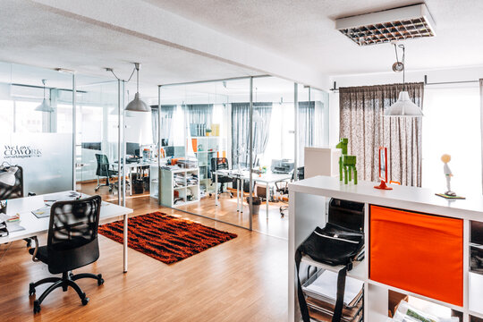 Modern open plan office interior with glass partitions