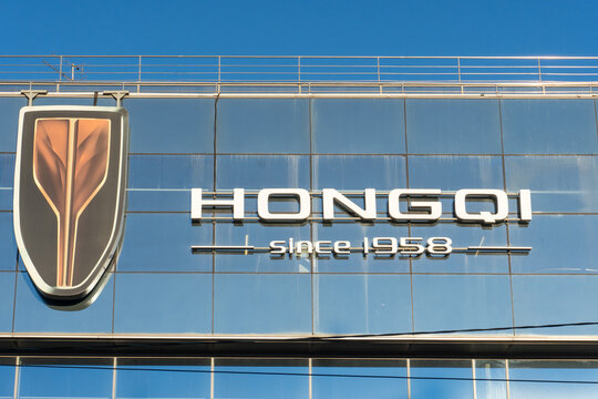 Dealer store Hongqi. Brand's showroom Chinese dealership. Hongqi brand display model cars in showroom or retail space, showcasing luxury automotive heritage of Chinese manufacturer founded in 1958. 