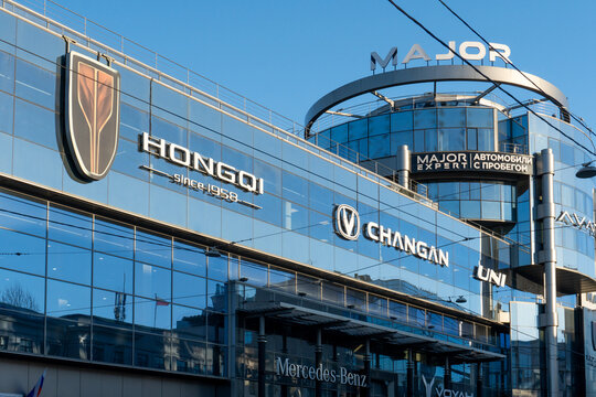 Dealer store Hongqi. Brand's showroom Chinese dealership. Hongqi brand display model cars in showroom or retail space, showcasing luxury automotive heritage of Chinese manufacturer founded in 1958. 