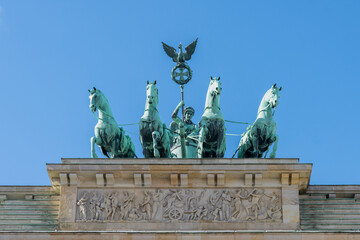 Obraz premium Winged Quadriga Statue Brandenburg Gate Berlin. The winged Quadriga Statue on top of the Brandenburg Gate in the city center of Berlin, Germany. 