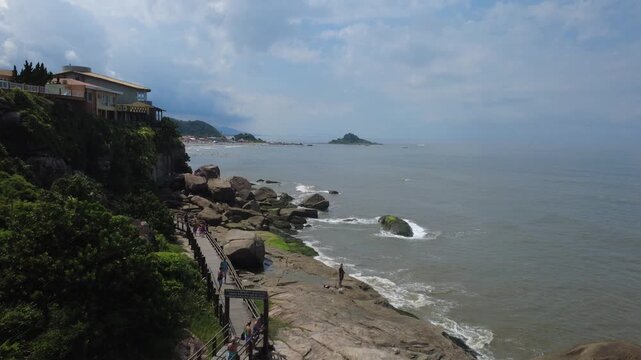 Rocky Coastal Trail Surrounded by Tropical Nature