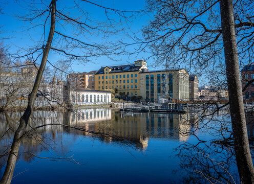 Motala Stream and the industrial landscape at Drags during spring. Norrk&ouml;ping is a historic industrial town in Sweden.