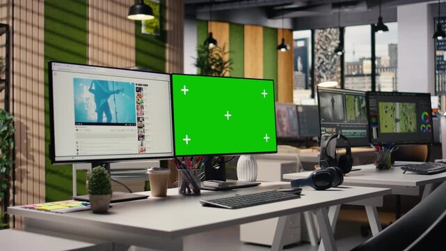 Isolated mockup screen and video streaming on platform in empty agency office, content and green screen on dual monitors. Entertainment materials within social network, user engagement.