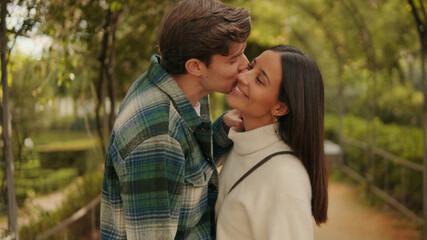 Fototapeta premium Romantic Couple Kissing In Park Outdoors Moment
