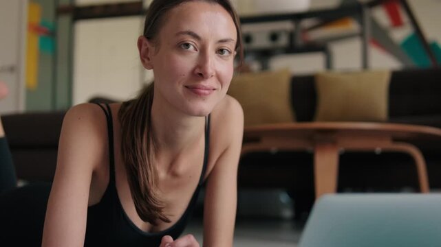 Woman Doing Fitness at Home with Laptop