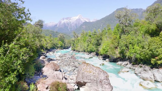 Hornopir&eacute;n, Chile - March 20, 2026: The Blanco River, with its turquoise waters, flows through the lush nature of Chilean Patagonia. The majestic Cerro Cholila can be seen in the mountains.