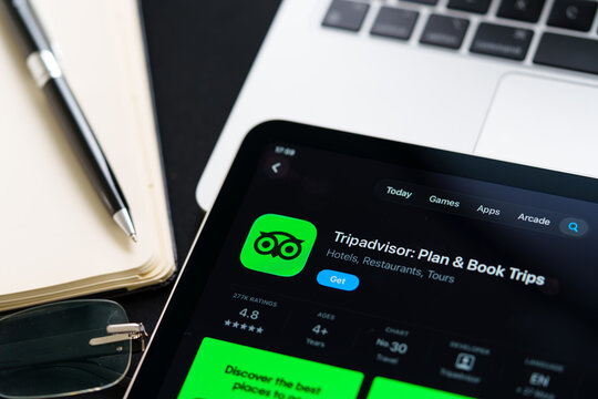 Tripadvisor iPad App Store screen showing Apple Liquid Glass redesign and iOS 26 style in workspace closeup. Stafford, United Kingdom, April 13, 2026.