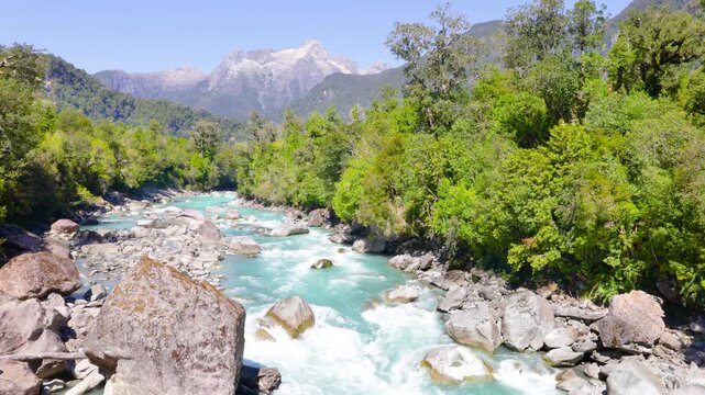 Hornopir&eacute;n, Chile - March 20, 2026: The Blanco River, with its turquoise waters, flows through the lush nature of Chilean Patagonia. The majestic Cerro Cholila can be seen in the mountains.