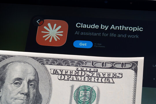 Claude iPad App Store screen with Apple Liquid Glass updated look and iOS 26 styling next to 100 dollar bill. Stafford, United Kingdom, April 13, 2026.