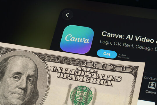Canva iPad App Store screen with Apple Liquid Glass updated look and iOS 26 styling next to 100 dollar bill. Stafford, United Kingdom, April 13, 2026.