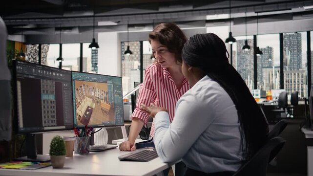 Team of diverse architectural specialists working with CAD program on computer, modern apartment layout with floor plan. 3D rendering software on dual monitors, interior design.