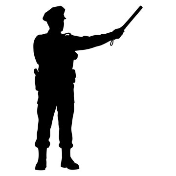 Silhouette of a police officer directing traffic with a baton.