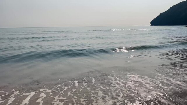 Tranquil beach surface sunlight