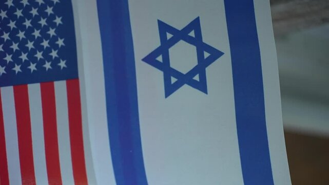 The flags of the United States and Israel are displayed side-by-side, symbolizing their bilateral relationship.