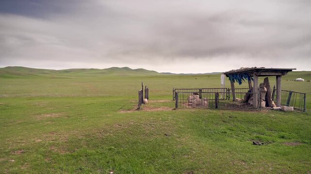 Historical Ongin inscription monument, Turkic stone statues on Mongolian steppe archaeological site. Ancient memorial stele and carved warrior figures beside Orkhon valley, weathered nomad era relics.