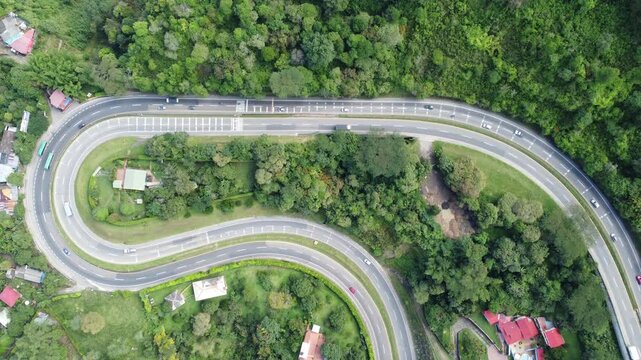 Top view zoom out road timelapse la vega cundinamarca colombia curve, intersection trucks and cars on road