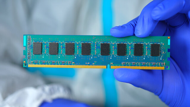 RAM stick with DRAM, Dynamic Random Access Memory chips. Core storage components holds data temporarily for quick CPU access. Storage of binary information using billions of capacitors and transistors