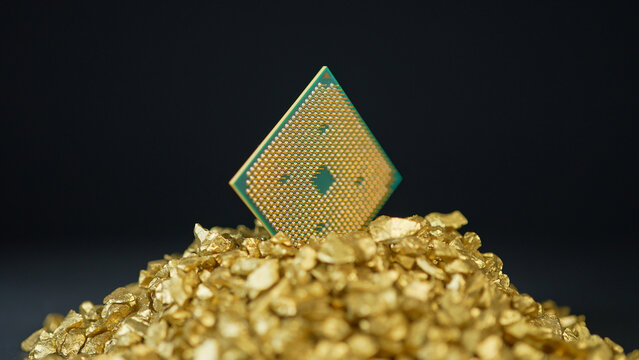 CPU in gold nuggets, concept of semiconductor and microchips shortage along with sanctions and geopolitical tensions, critical mineral embargo and rear earth mining. Blockchain and bitcoin concept.