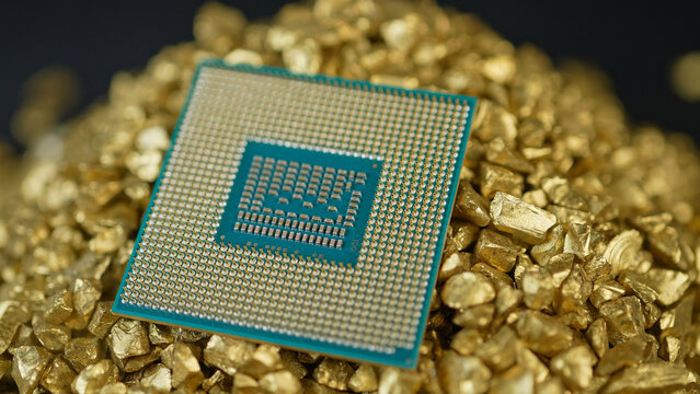 CPU or GPU in pile of gold nuggets display, concept of rear earth elements mining demand. Mining and AI global demand for REEs. Building of data centers and processing power for AI and LLMs.