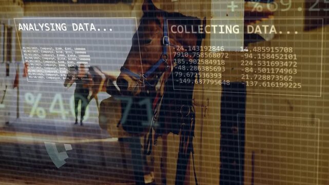 Stable worker walking down barn aisle while horse in stall wearing halter, HUD overlays appearing