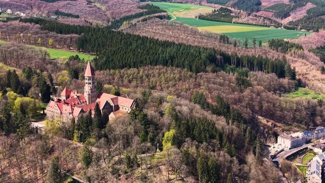 A panoramic Aerial view of the city and castle  Clervaux in Luxembourg, on a sunny spring noon