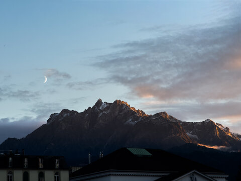 Mount Pilatus with Crescent Moon at Dusk over Lucerne, Switzerland
