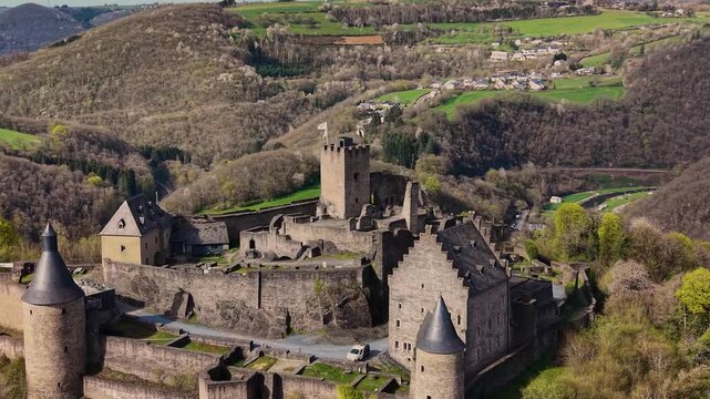A panoramic Aerial view of the city and castle  Bourscheid in Luxembourg, on a sunny spring noon