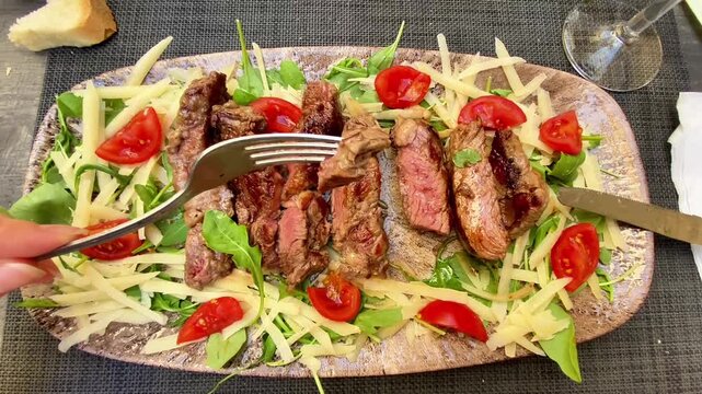  Top-Down View of Beef Tagliata with Parmesan and Fresh Rocket