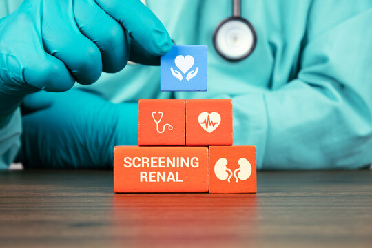 Concept of renal follow-up, serum creatinine monitoring, and silent kidney cancer. A nephrologist's hand arranges wooden cubes with kidney icons. Renal screening.