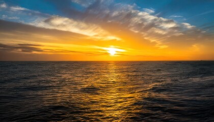 Obraz premium Golden Hour Serenity - A Breathtaking Ocean Sunset with Reflective Waters.