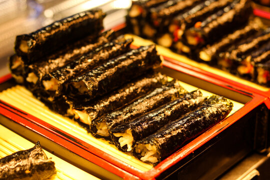 A display of mini Gimbap rolls, known as Mayak Gimbap. An authentic Korean street food.