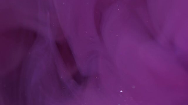 Vertical video. Sparkling mist. Blur paint smoke. Purple glitter particles blend liquid spill abstract background. Color cloud water dissolve.