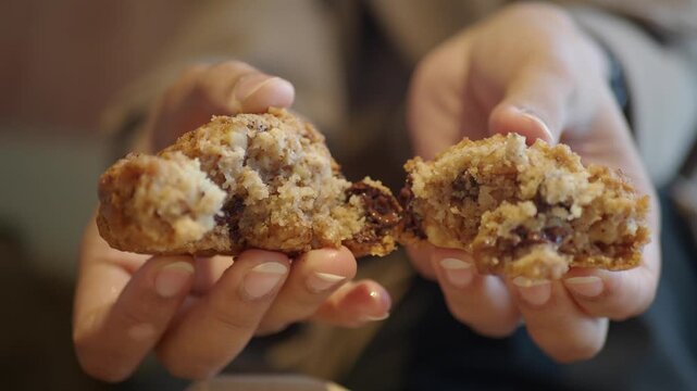 Enjoying a fresh cookie in a cozy cafe