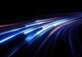Fototapeta premium curving blue, white, and red light trails racing across a black background, evoking speed, motion, and energetic futurism