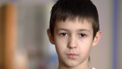 portrait serious boy looking at camera, have fun © vla