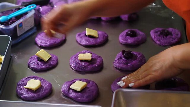 Ube cheese pandesal being prepared for baking