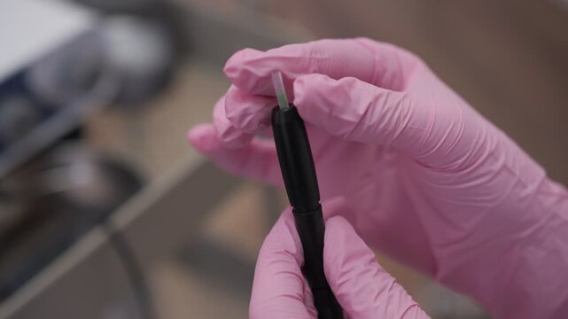 Hair transplant surgeon preparing fue implanter pen