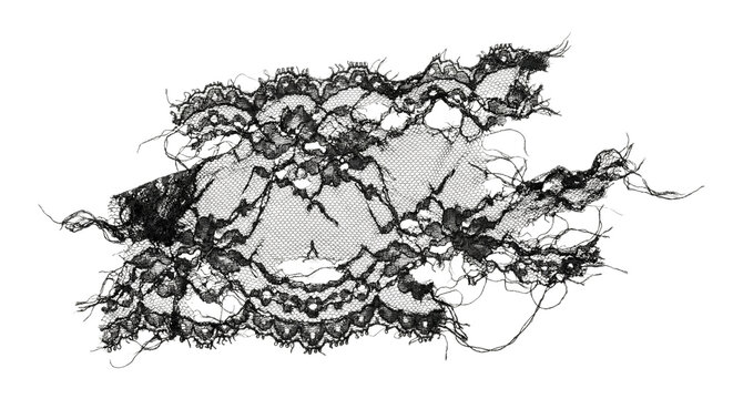 Distressed tattered black lace fabric piece with frayed edges