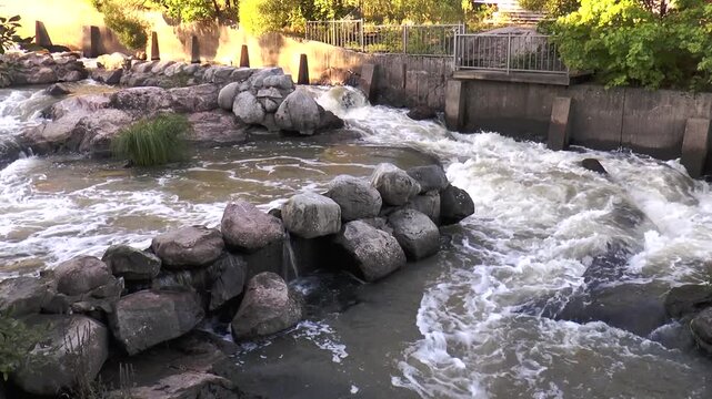 Helsinki, Finland. Cascades and shallows of the river Vantaa. Warm summer  evening.