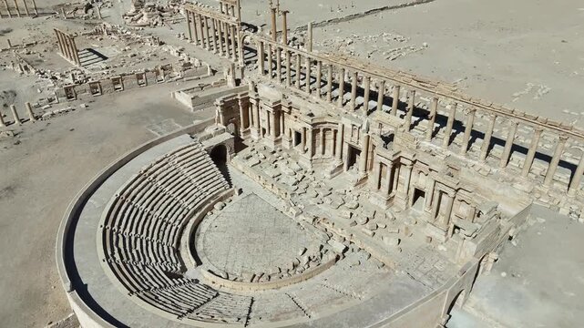 Aerial view of the ancient Roman Theater in Palmyra, Syria. Iconic UNESCO World Heritage archaeological site featuring historic desert ruins and architecture