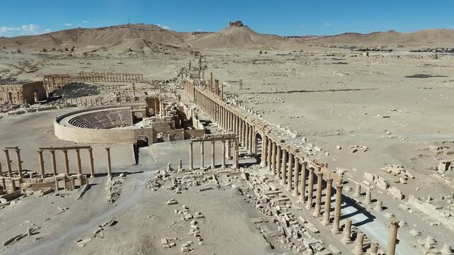 Aerial perspective of the ancient Roman ruins and desert landscape of Palmyra, Syria. Historic archaeological site and UNESCO world heritage landmark