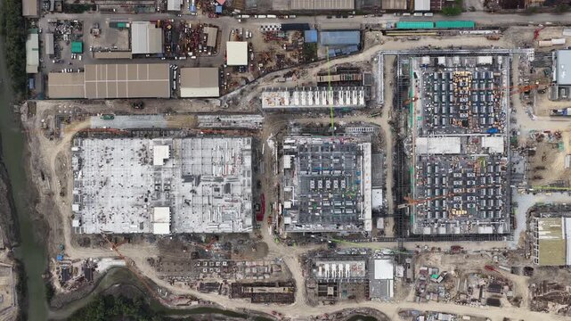 Aerial drone video of Data Centre QHI01 hyperscale campus construction in Chonburi, Thailand, within the Eastern Economic Corridor, showing large scale cloud computing, AI infrastructure, and