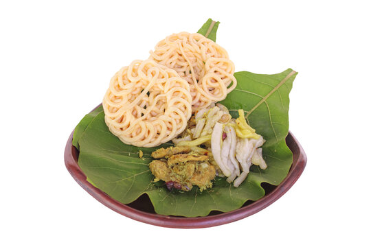 Traditional Indonesian Kerupuk and Spicy Salad on Teak Leaf