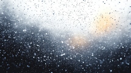 Obraz premium snowflakes and water droplets on a fogged window with falling snow outside and a soft orange blurred light, quiet cold and contemplative mood