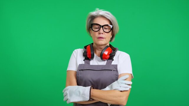 Exhausted tired mature female construction worker wiping sweat