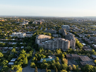 Obraz premium Aerial view of Universite de Montreal campus and Outremont district surrounded by forested Mount Royal at sunset, Montreal Canada. g.