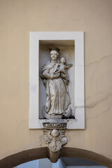 Statue of Virgin Mary with Child in niche on wall of 14th century baroque Jasna Gora Monastery, Czestochowa, Poland © mychadre77