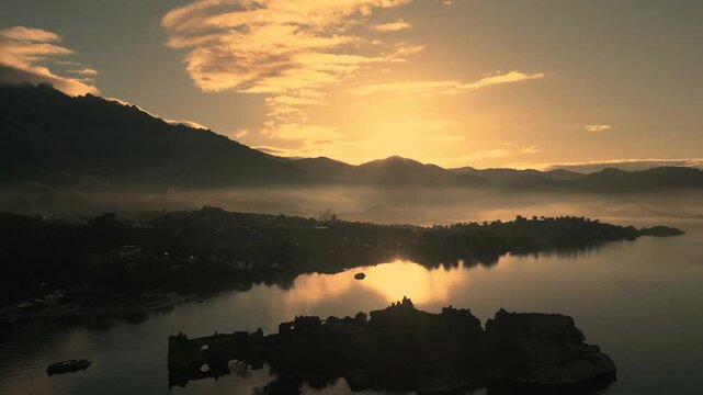 Breathtaking Aerial View of Bafa Lake at Sunrise with Fog and Ancient Ruins, Turkey. High quality 4k footage