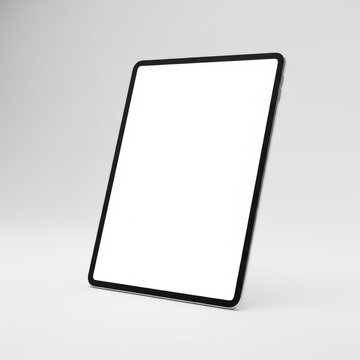 Tablet computer with blank white screen standing at an angle